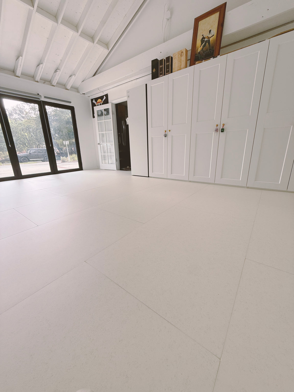 A white room with a soft floor fitted from wall to wall