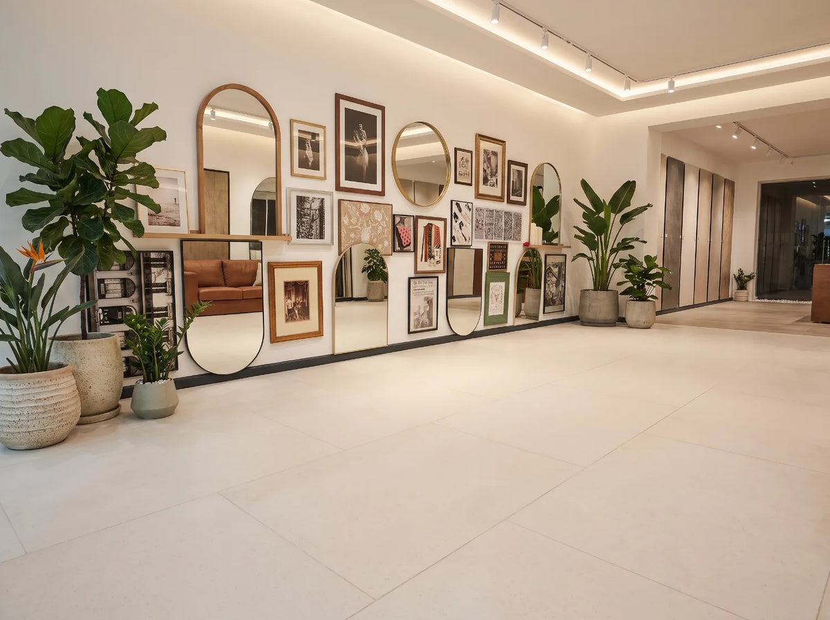 The Matnificent space with a styled gallery wall above the signature cream tile floor