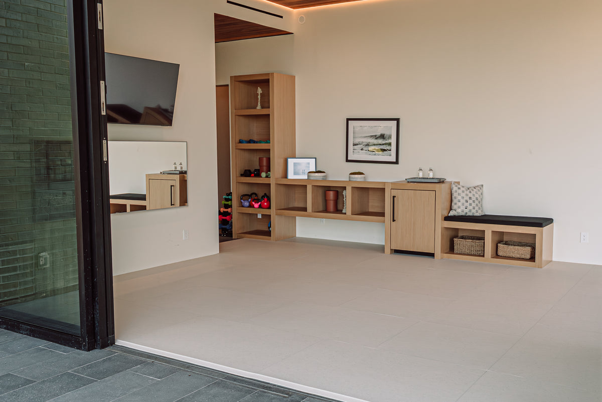 A living space with a soft floor fitted around the built-in furniture